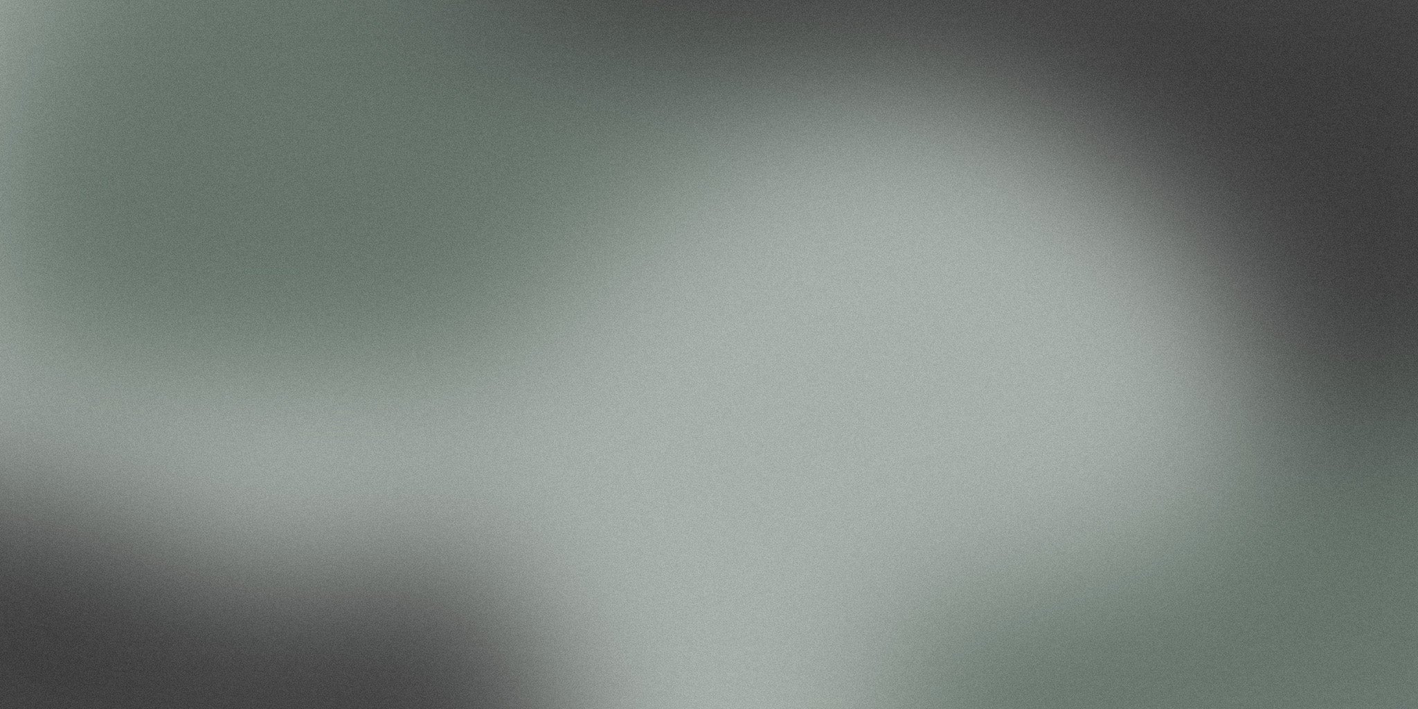 Minimalist soft grey gradient background with subtle vignette effect