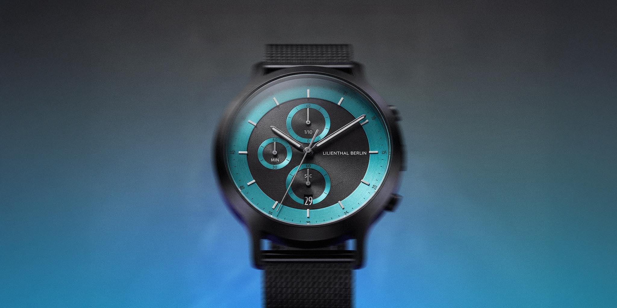 Black and cyan chronograph watch with mesh strap and three subdials on gradient background