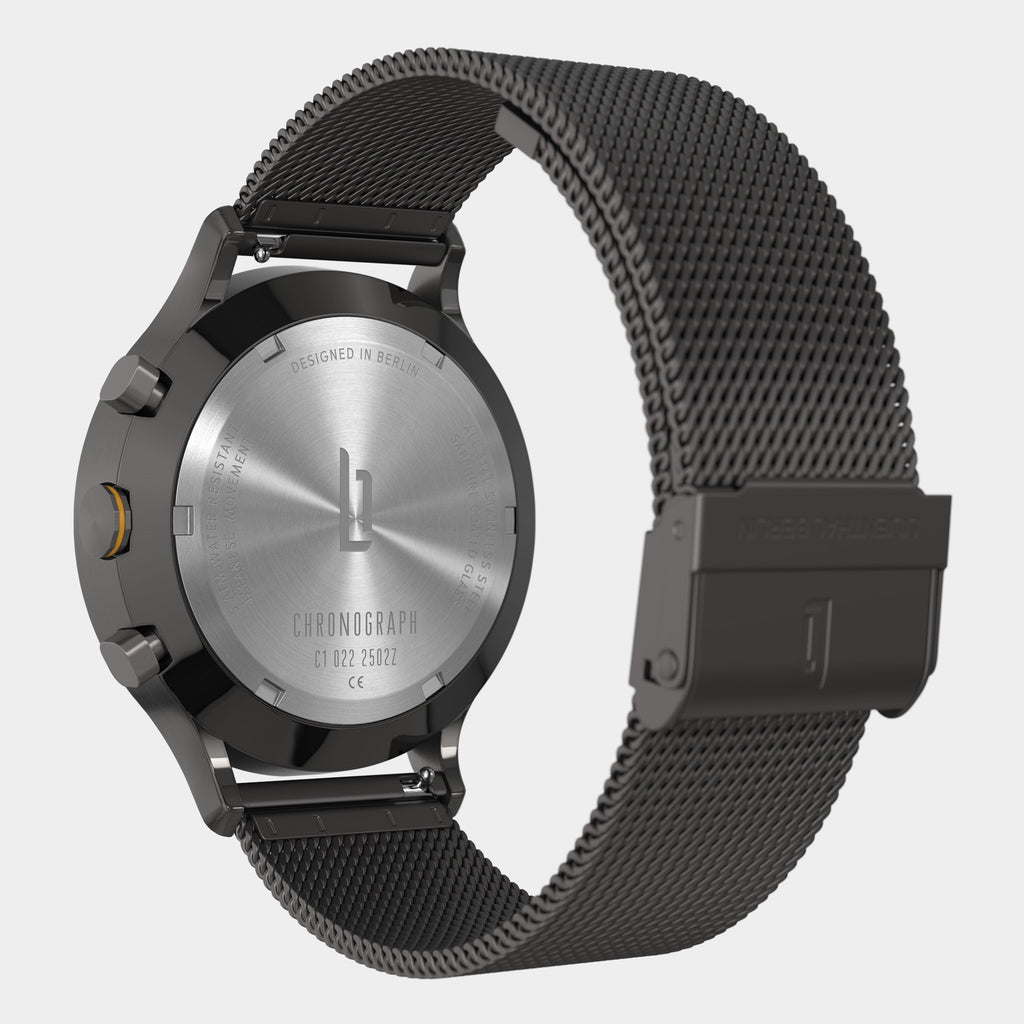 Minimalist chronograph watch back with stainless steel case and black mesh strap