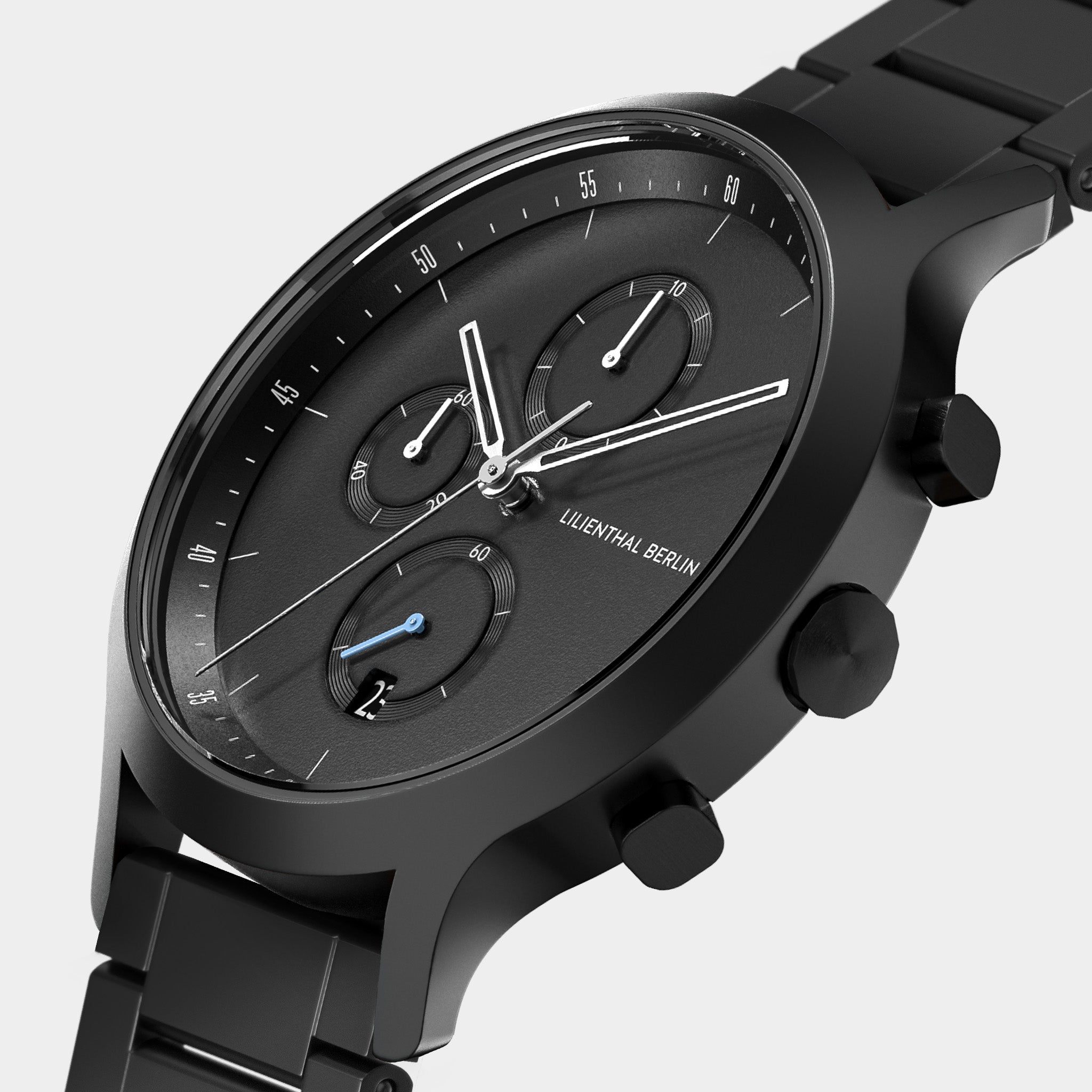 Black chronograph watch with metal strap, minimalist dial, and three subdials