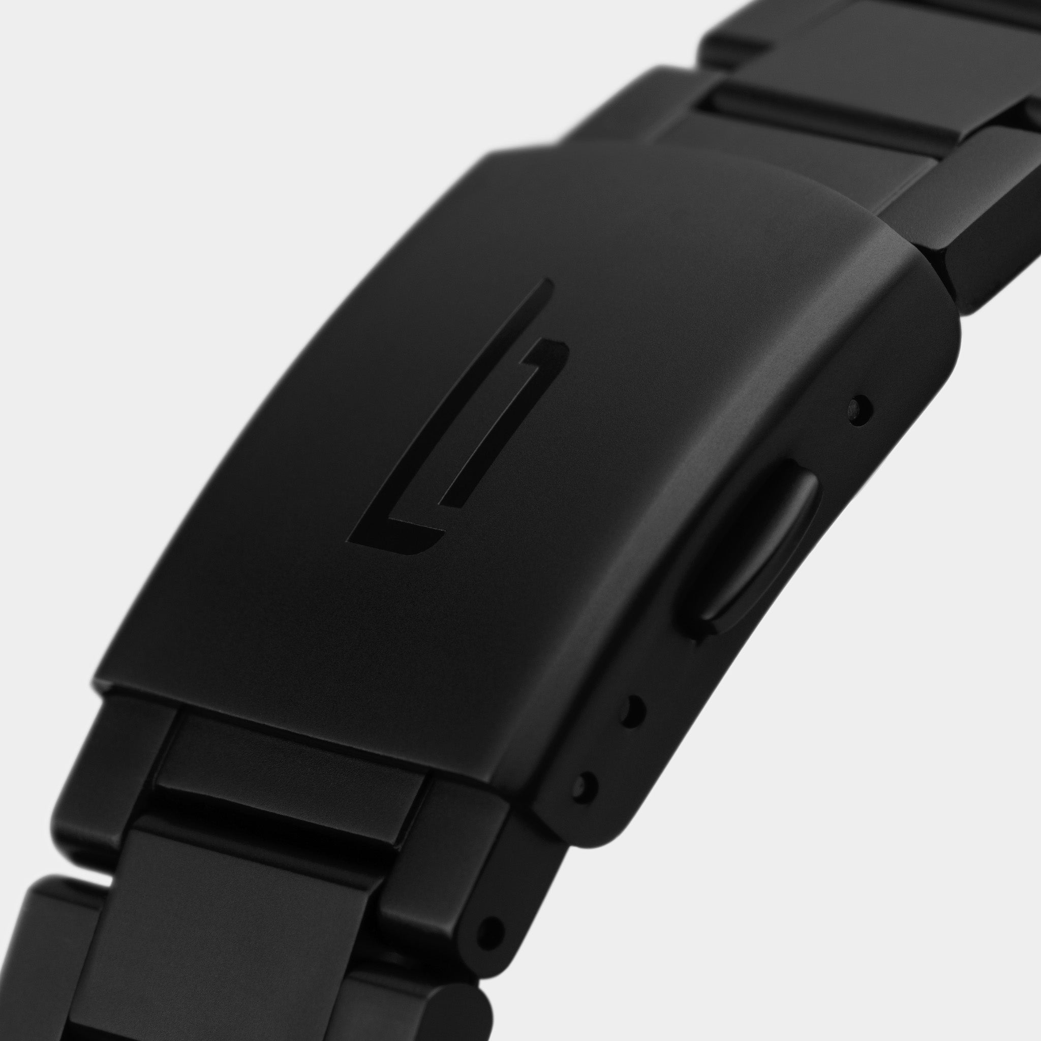 Black stainless steel watch clasp with engraved logo, modern matte finish