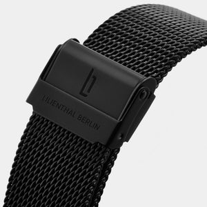 Black stainless steel mesh watch strap with Lilienthal Berlin logo, close-up