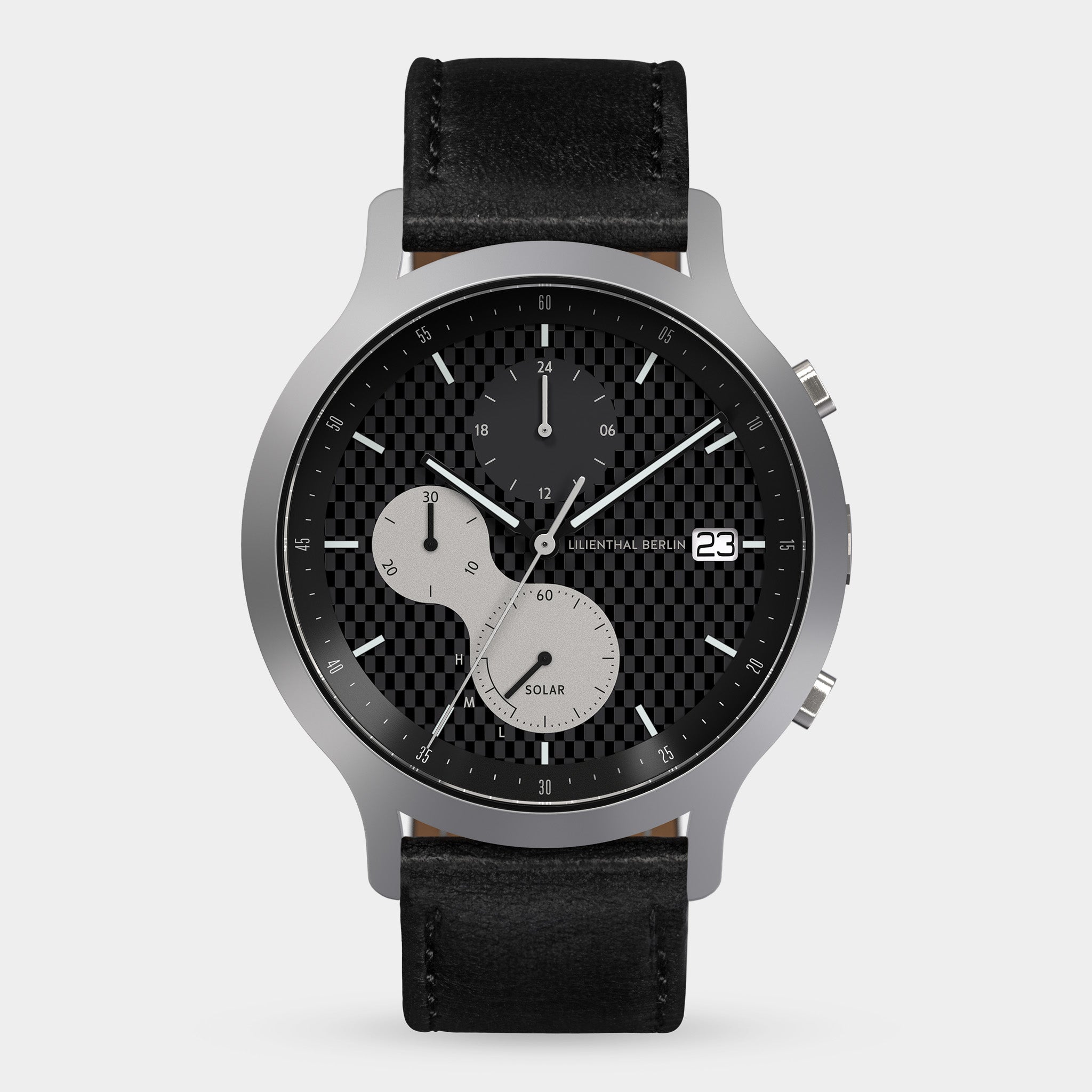 Solar-powered chronograph watch with black checkered dial, date display, and black leather strap