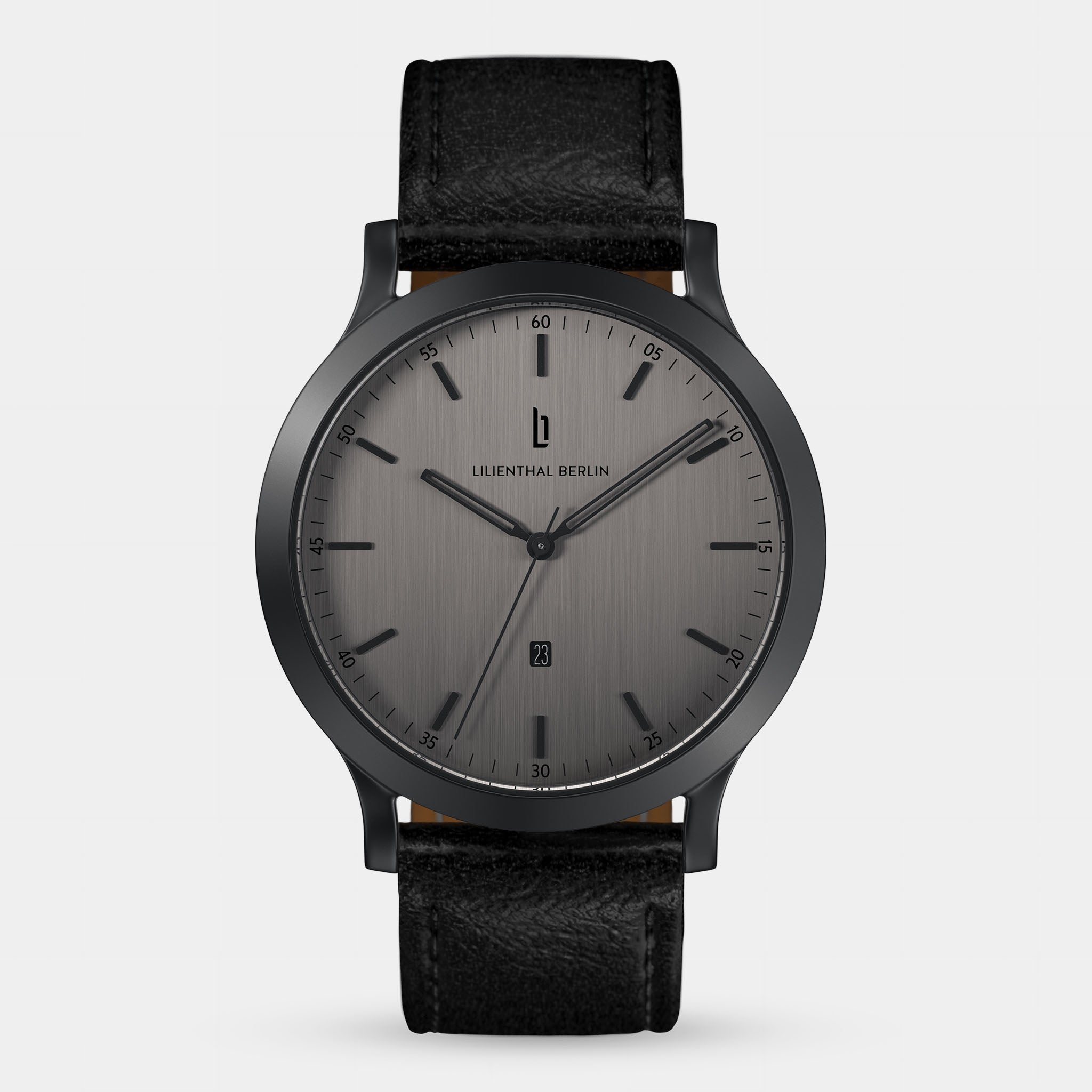 Minimalist black wristwatch with brushed gray dial, black markers, and black leather strap