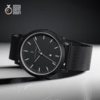 Minimalist black designer watch with mesh strap and date display, German Design Award 2021 winner