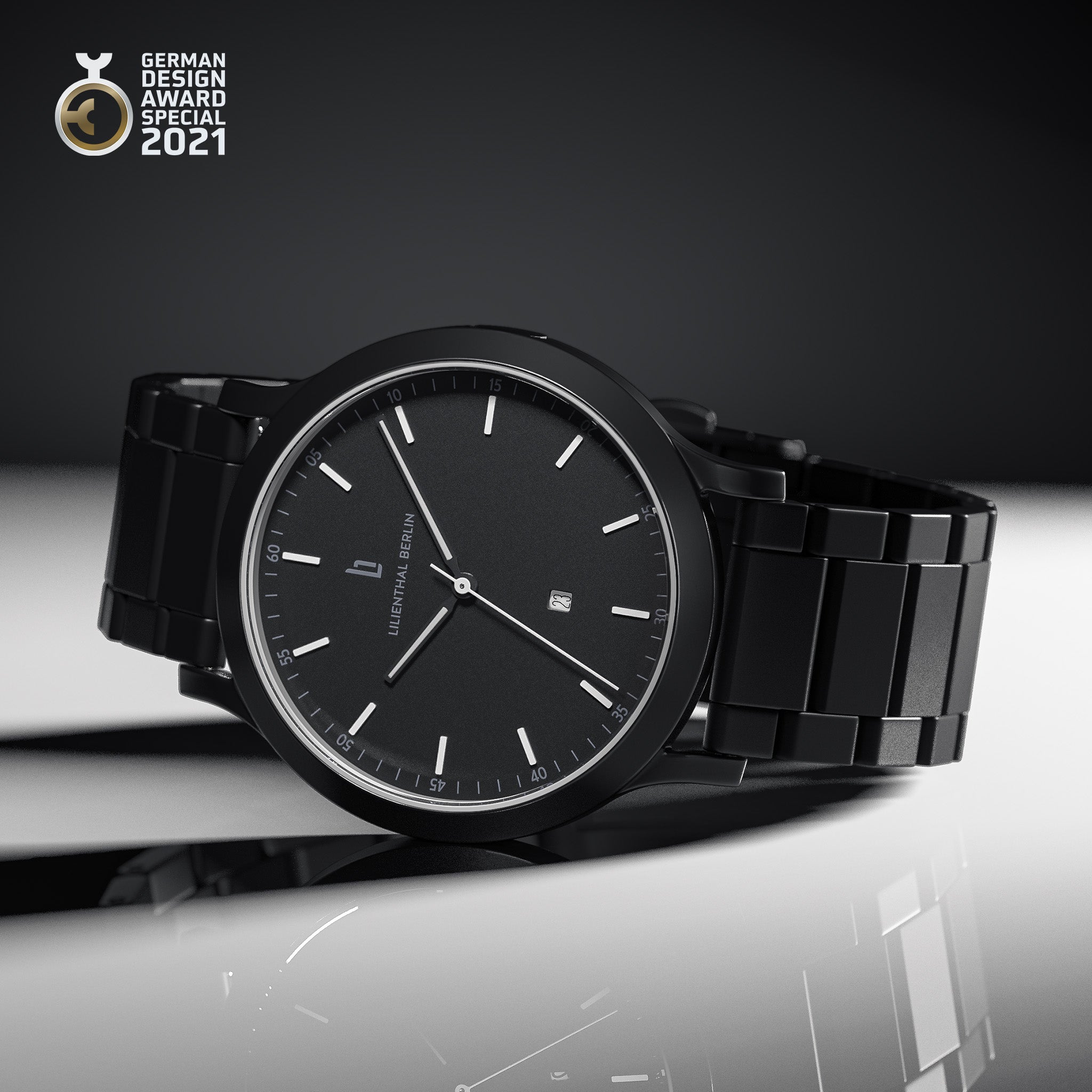 Minimalist black wristwatch with metal band, date display, and German Design Award 2021 badge