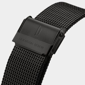 Black stainless steel mesh watch band with engraved clasp and modern design