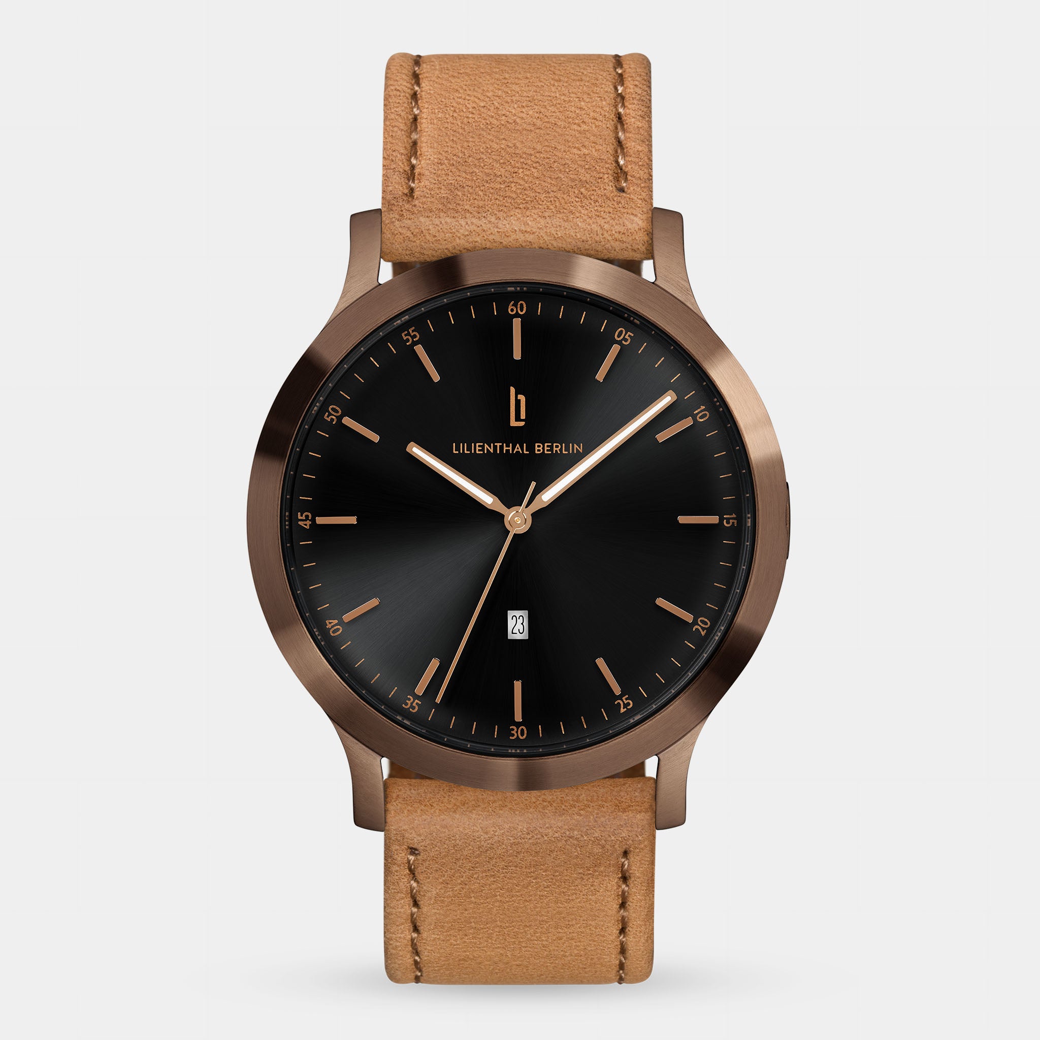 Minimalist watch with black sunburst dial, rose gold details, date window, and tan leather strap