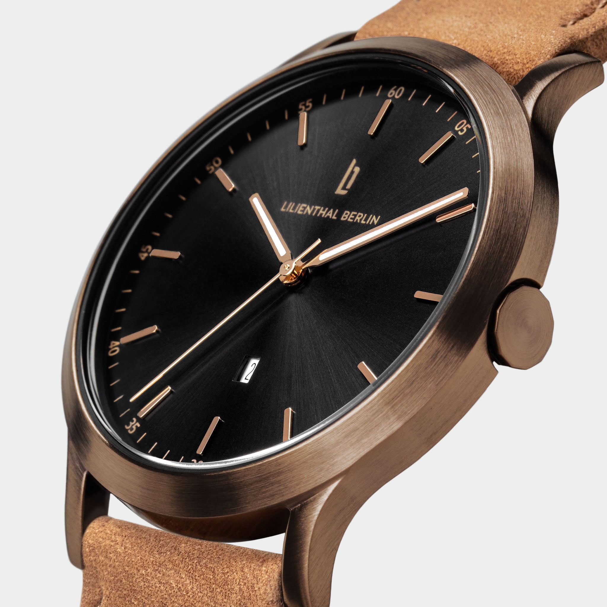 Elegant men's wristwatch with a black dial, bronze case, and light brown leather strap