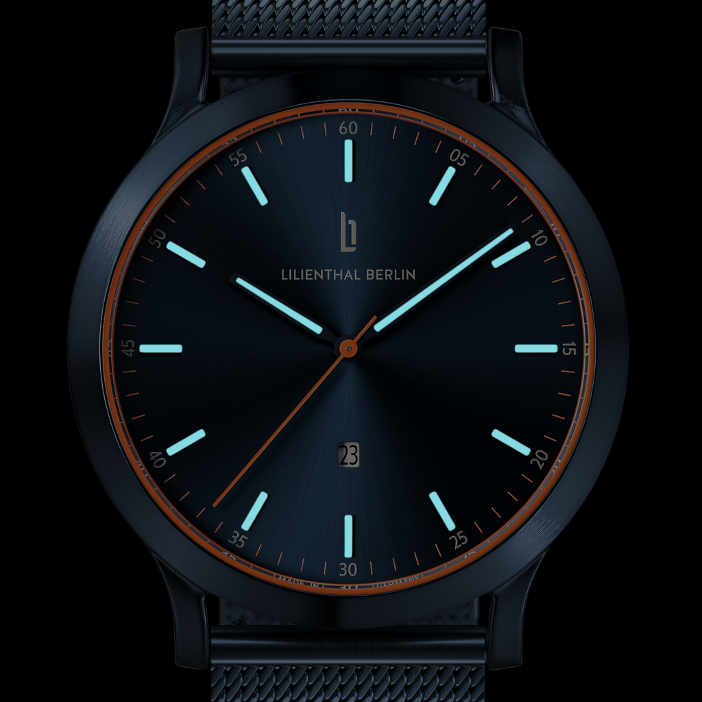 Modern black wristwatch with blue luminous markers, mesh strap, and minimalist dial design