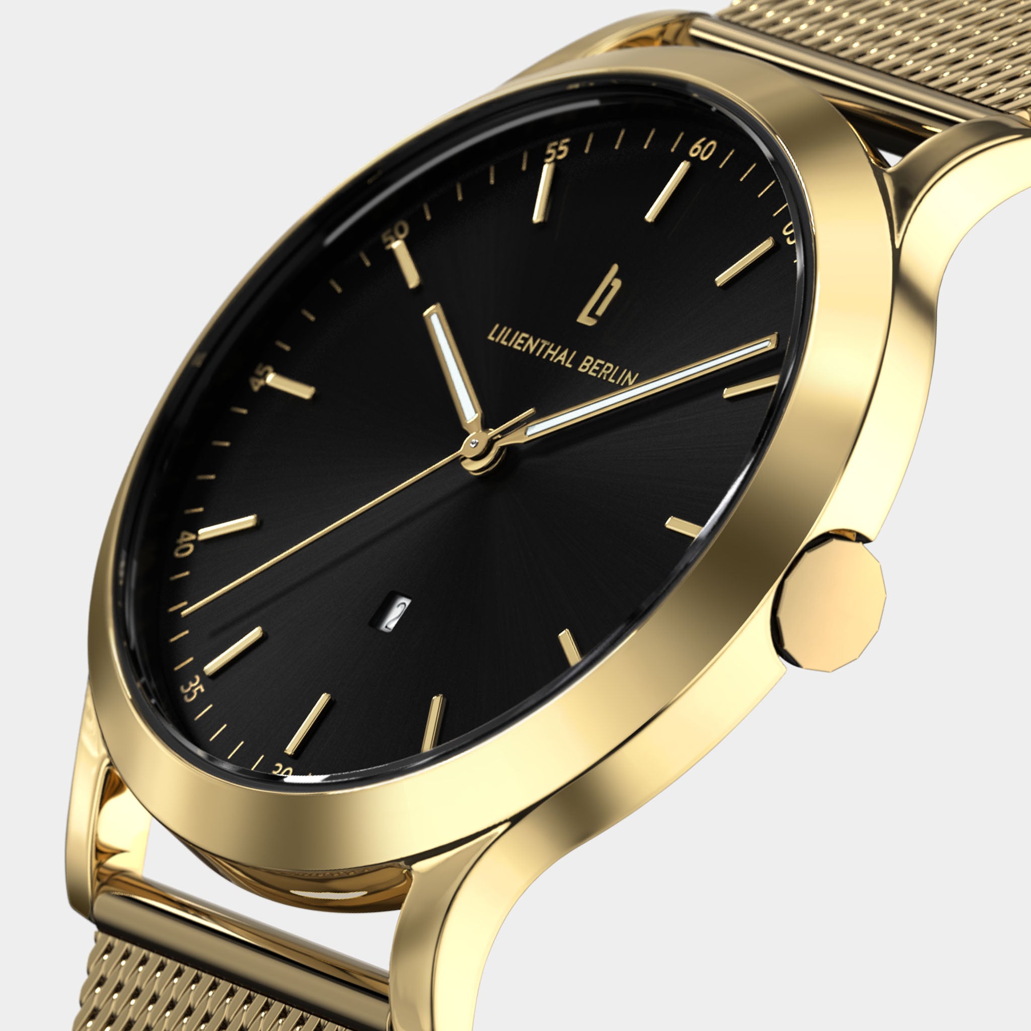 Gold minimalist watch with black dial, mesh strap, and date display on white background