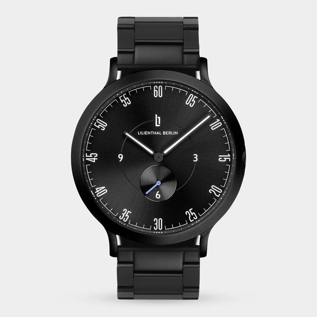 Sleek black stainless steel men's watch with minimalist dial and subdial on metal bracelet